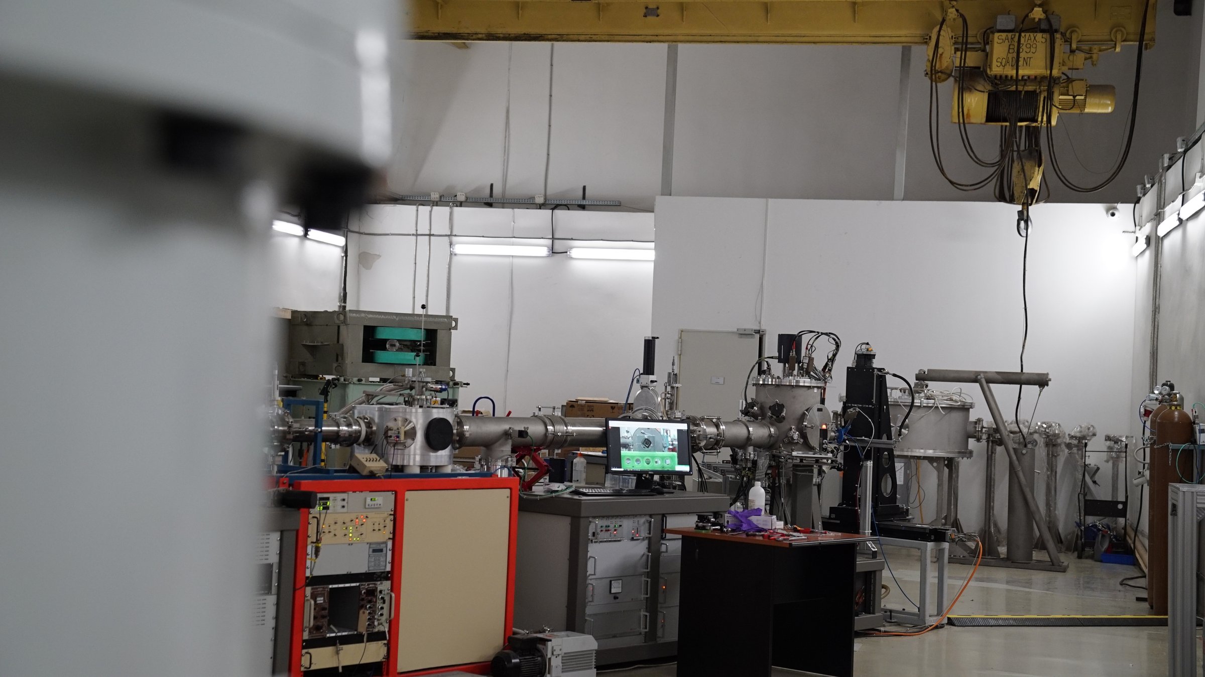 Overview of the 3 MV Tandetron beam lines with the HVEE high-voltage unit and overhead crane
