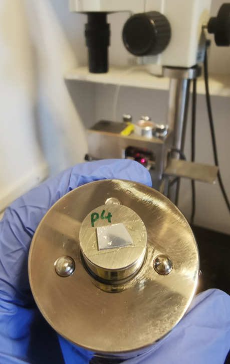 A sample mounted on a stainless-steel magnetic disc, about to be loaded onto the AFM scanner