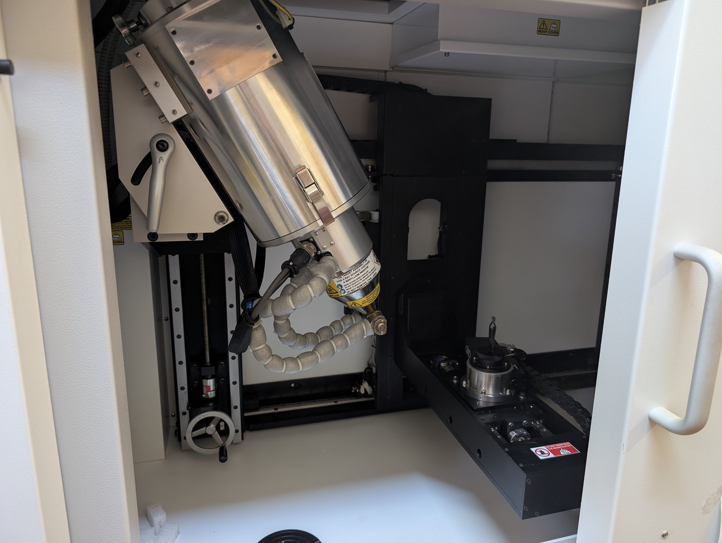 Interior of the Nikon XT H 225 X-ray CT cabinet, showing the micro-focus X-ray source and the rotation stage