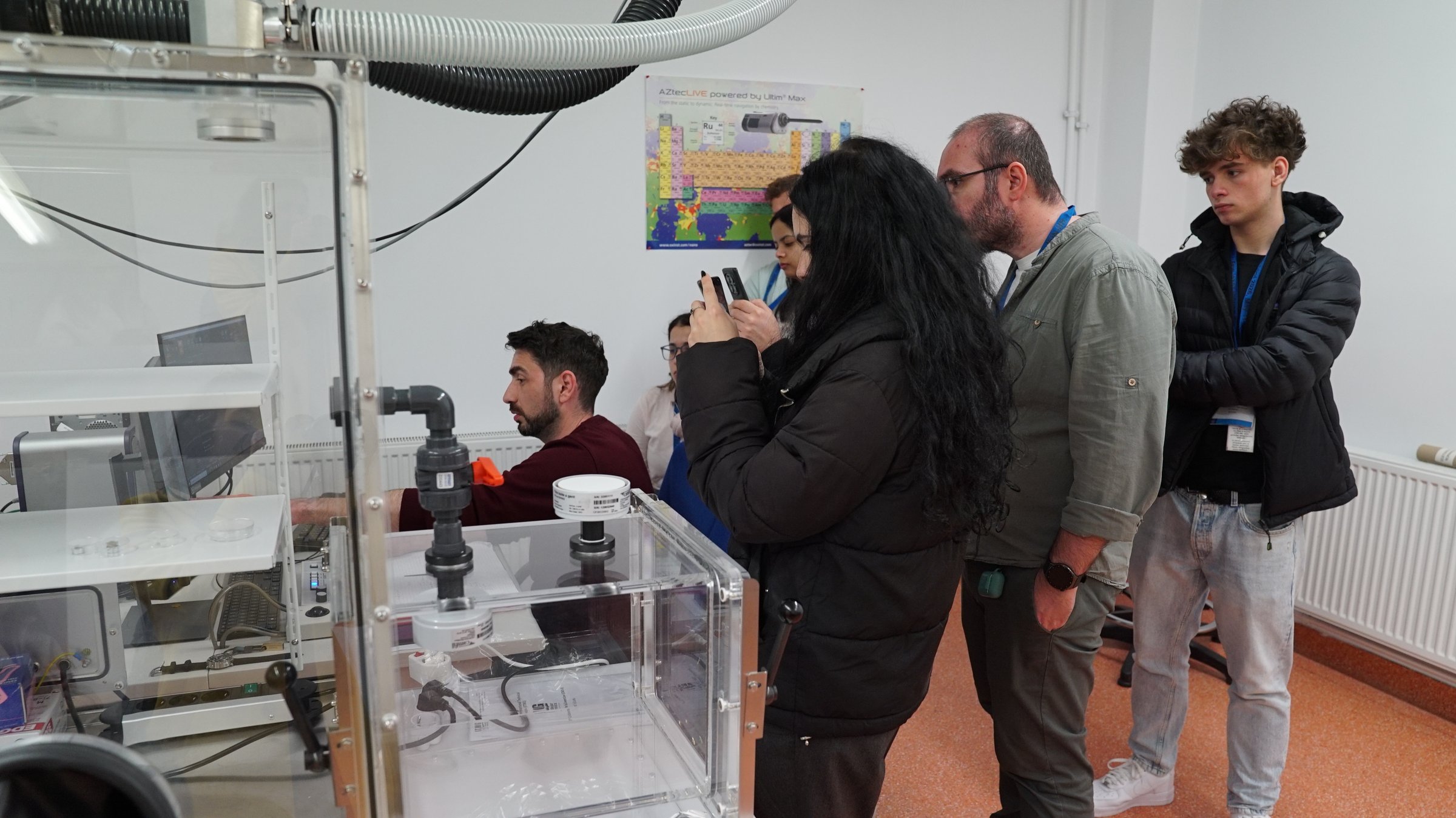 Visitors in the electron microscopy laboratory during a guided tour at TIESR