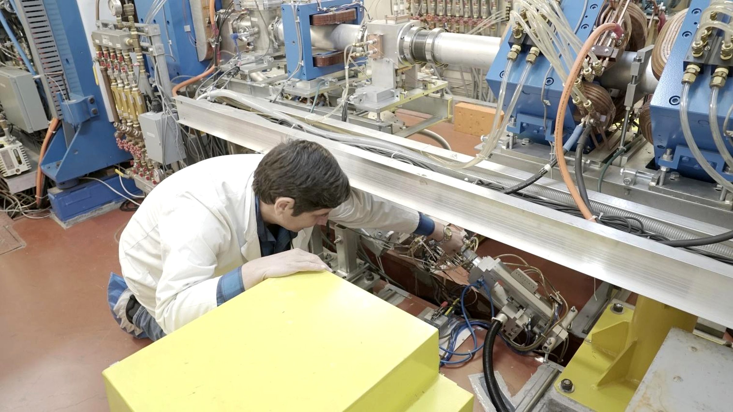A DFNA engineer adjusting the magnetic beam-transport elements of the TR-19 external proton beamline