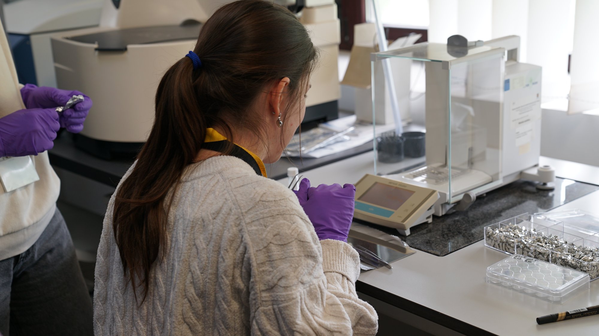 A trainee working at the target-preparation lab bench