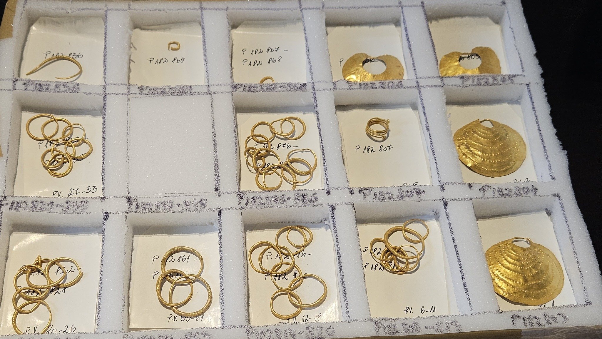 Close-up of a gold archaeological artefact
