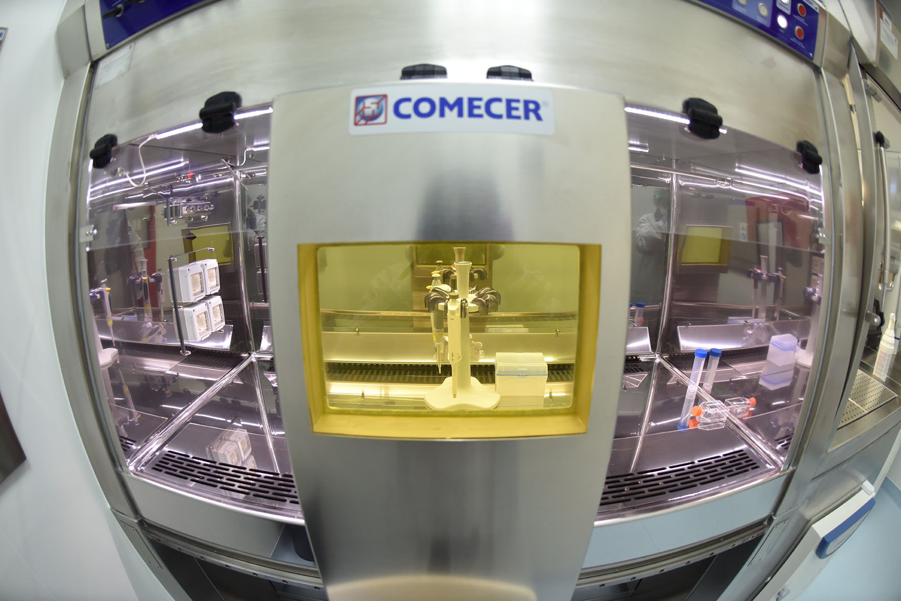 COMECER shielded isolator with an automated pipetting/synthesis module behind leaded glass